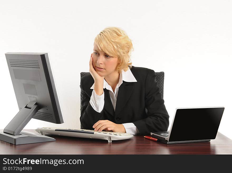 Young business woman working in a modern office.Isolated over white.