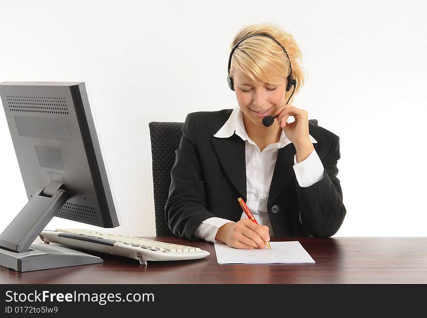 Young business woman working in a modern office.Isolated over white.