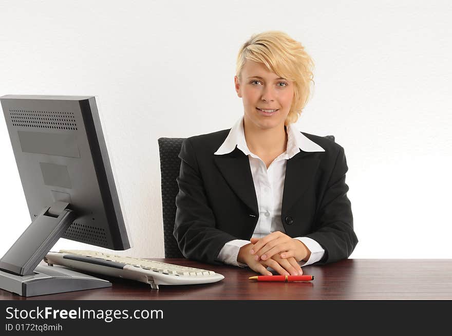 Young business woman working in a modern office.Isolated over white.