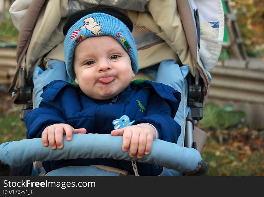 Little boy has put out tongue