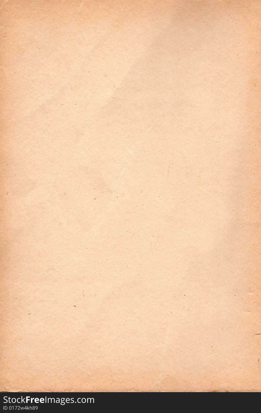 A sheet of old paper stained light brown. A sheet of old paper stained light brown