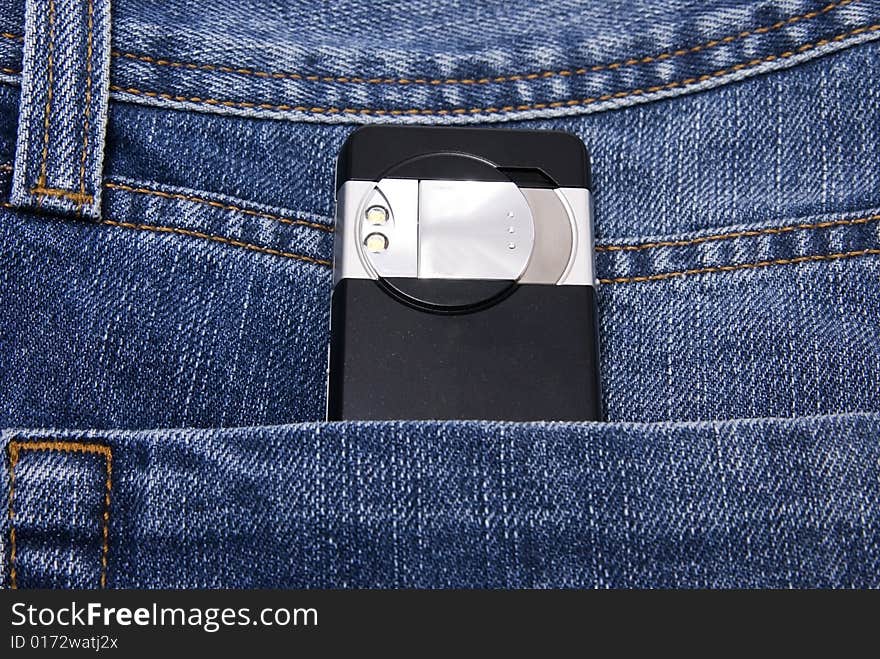 Digital camera of mobile phone in jeans pocket. Digital camera of mobile phone in jeans pocket