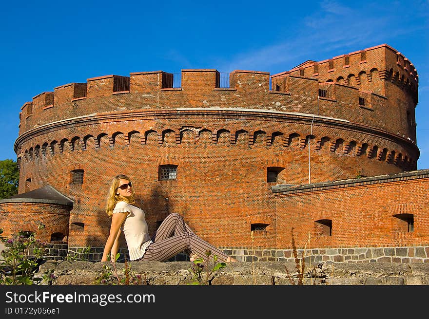 Girl posing near ancient fort. Girl posing near ancient fort