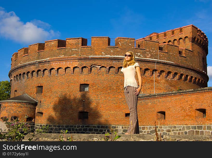 Girl posing near ancient fort. Girl posing near ancient fort