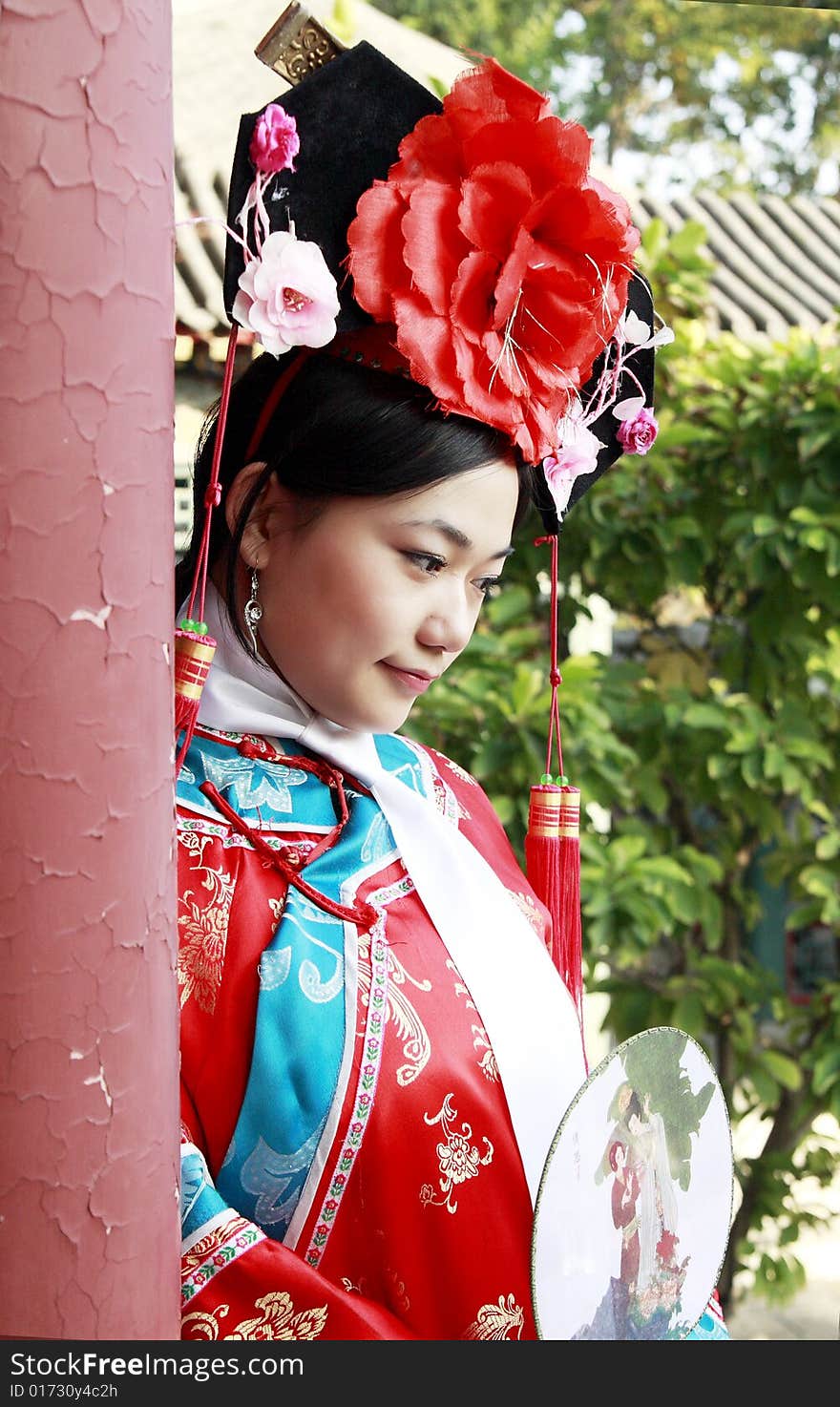 A beautiful girl in Chinese ancient dress is in the royal garden. This is dress of Qing Dynasty of China. It is the princess' dress too. Chinese on the fan is meant and missed. A beautiful girl in Chinese ancient dress is in the royal garden. This is dress of Qing Dynasty of China. It is the princess' dress too. Chinese on the fan is meant and missed.