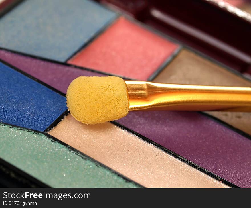 A colorful eyeshadow with applicator. A colorful eyeshadow with applicator