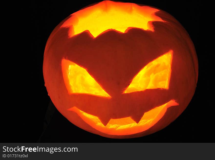 Scary pumpkin on black background