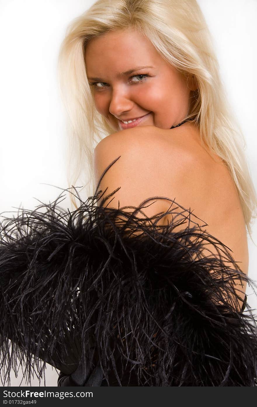 Coquettishly Smiling Young Girl With A Feather Fan