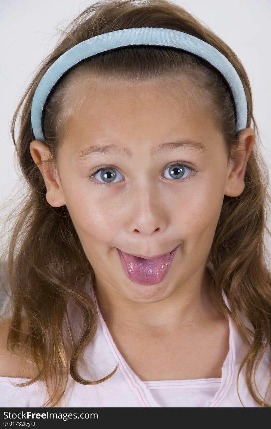 A little girl showing her tongue