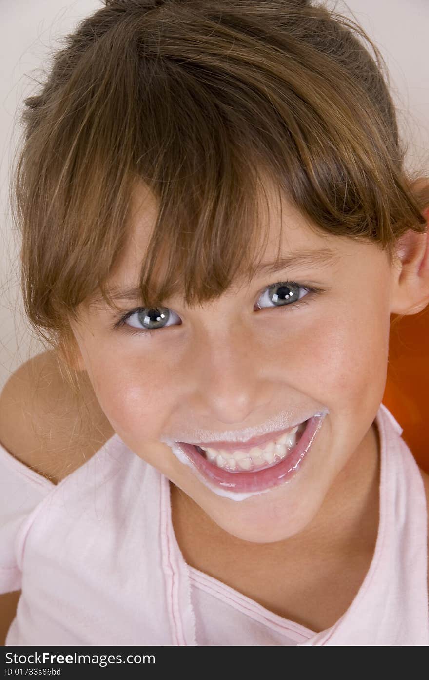 A smiling little girl looking at the camera