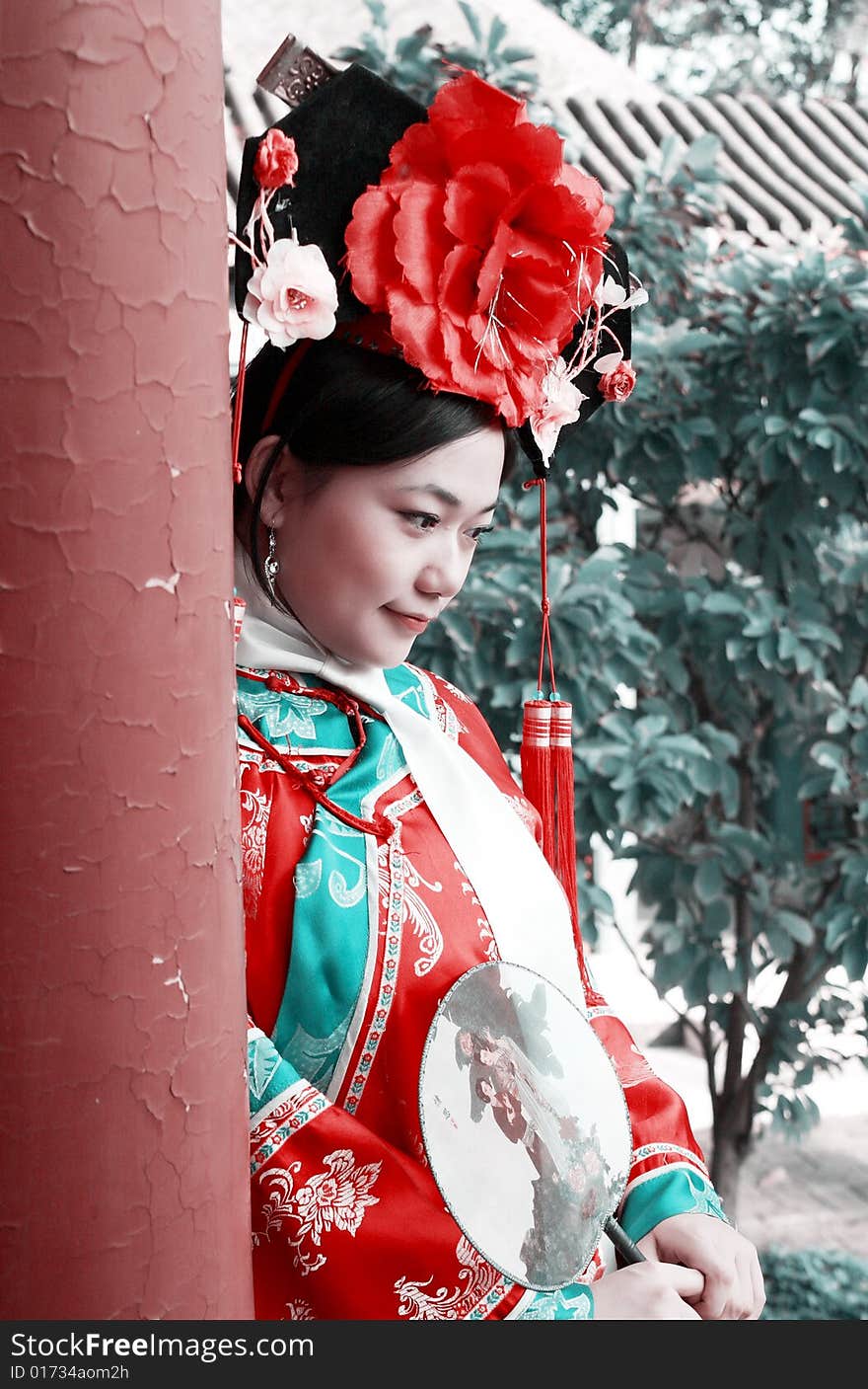 A beautiful girl in Chinese ancient dress is in the royal garden.

This is dress of Qing Dynasty of China. It is the princess' dress too.

Chinese on the fan is meant and missed. A beautiful girl in Chinese ancient dress is in the royal garden.

This is dress of Qing Dynasty of China. It is the princess' dress too.

Chinese on the fan is meant and missed.