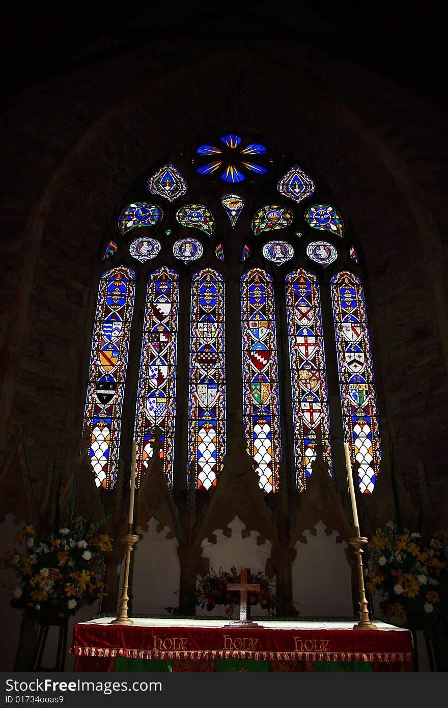 An alter and stained glass window in a church in cork ireland. An alter and stained glass window in a church in cork ireland