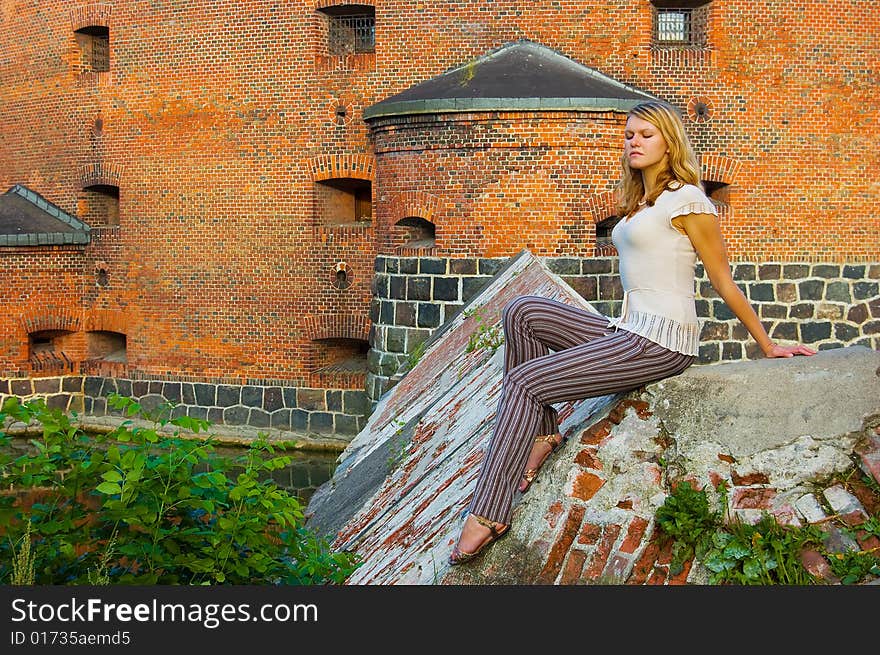 Girl posing near ancient fort. Girl posing near ancient fort