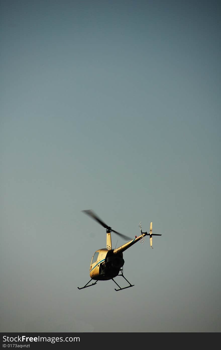 Chopper flying in the blue sky of italy. Chopper flying in the blue sky of italy