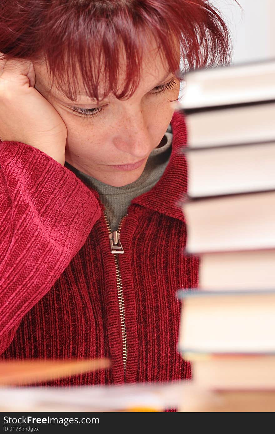 The woman closely studying the literature. The woman closely studying the literature