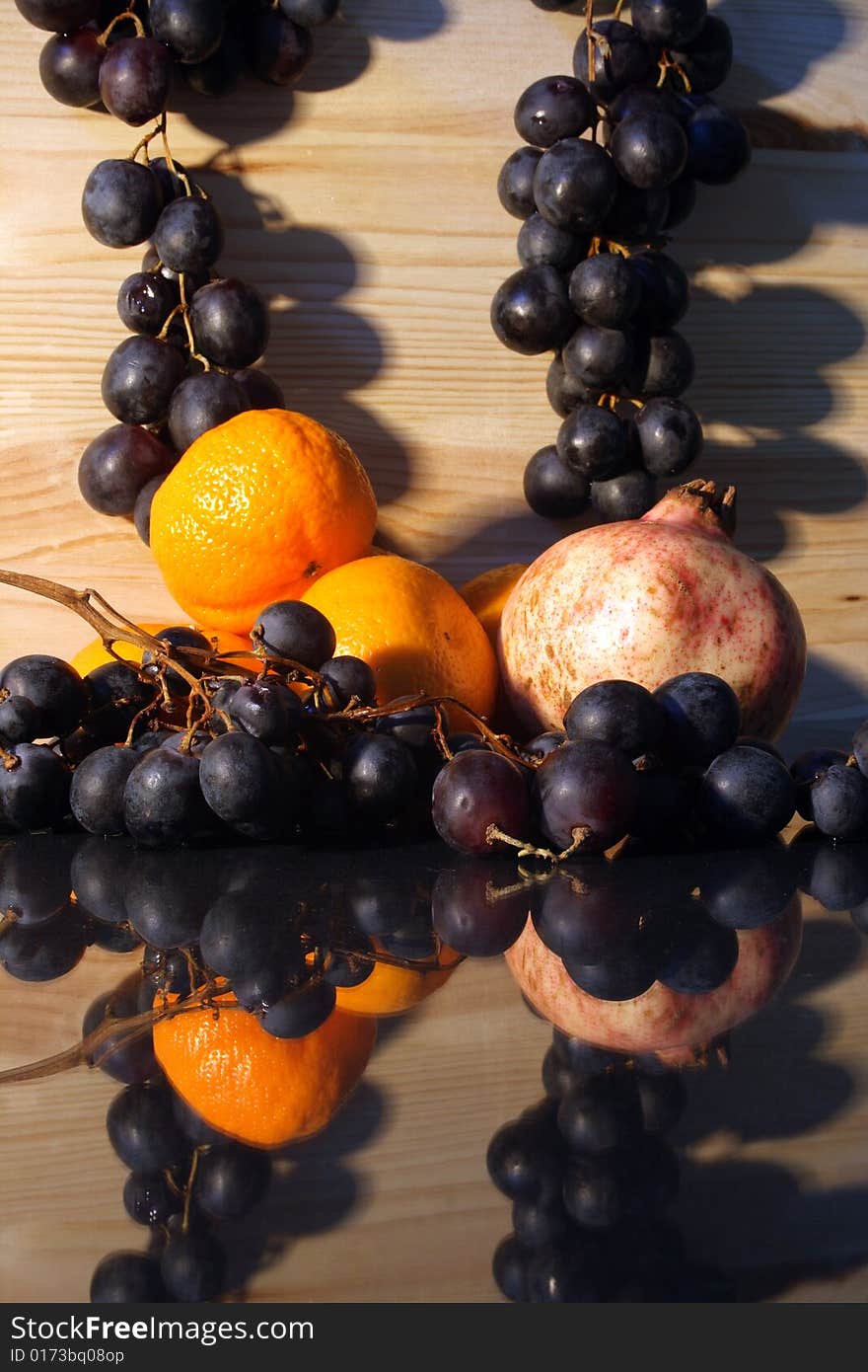 Various fruits on background with wooden wall