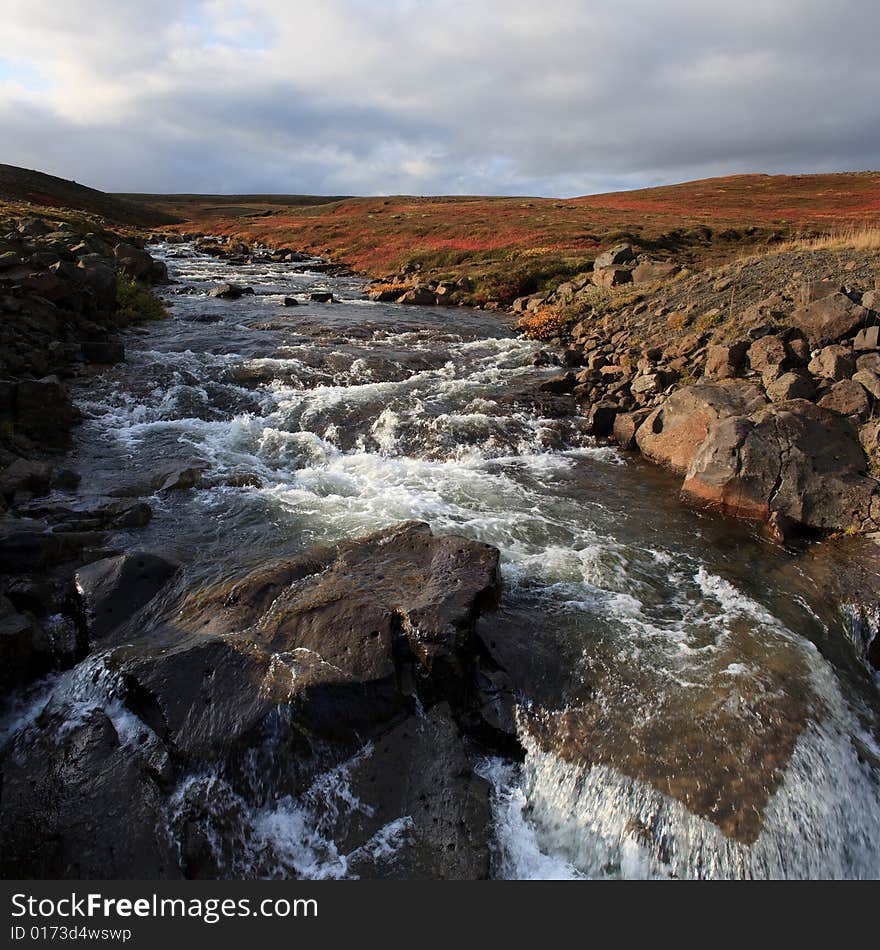 Landscape with fast river in Iceland