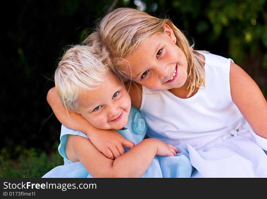 Beautiful little girls hanging out together in the summer. Beautiful little girls hanging out together in the summer