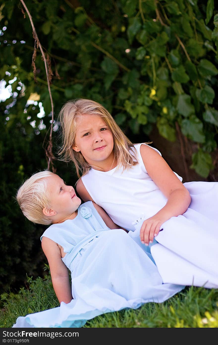 Beautiful little girls hanging out together in the summer. Beautiful little girls hanging out together in the summer