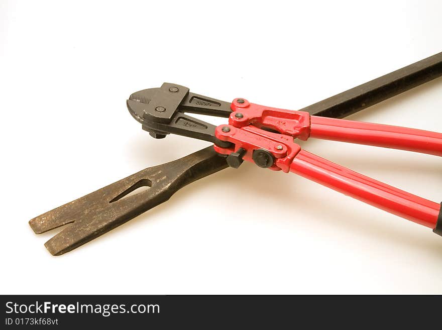 New red bolt cutters and old prybar. New red bolt cutters and old prybar