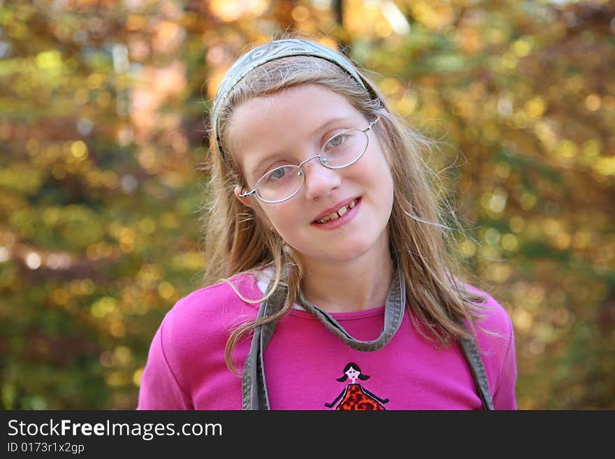 Happy girl in the autumn forest with colourful leaves. Happy girl in the autumn forest with colourful leaves