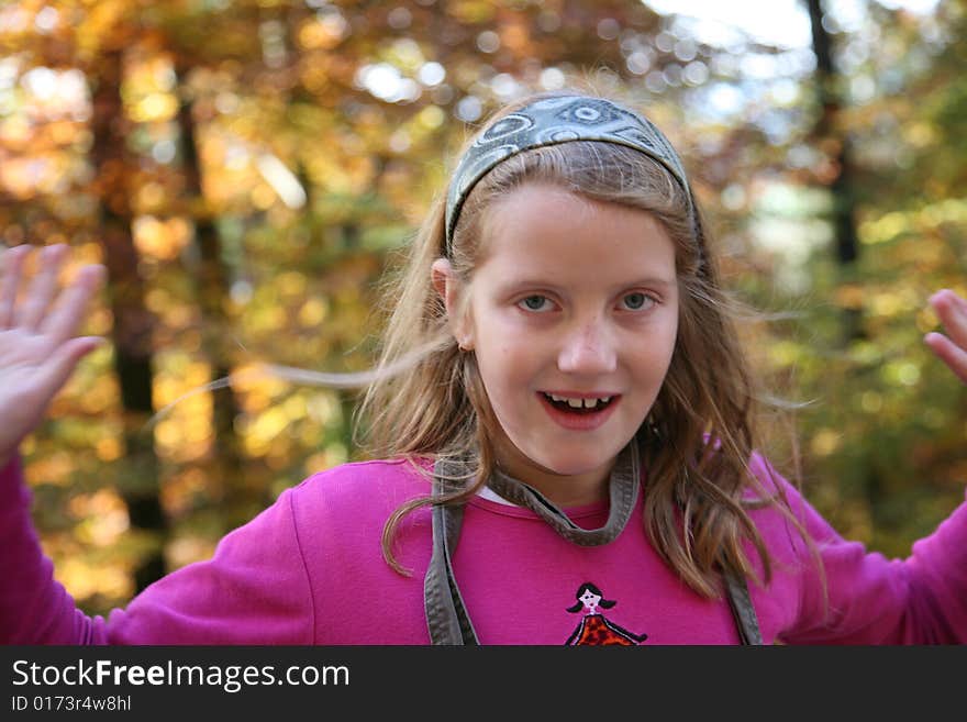 Happy girl in the autumn forest with colourful leaves. Happy girl in the autumn forest with colourful leaves