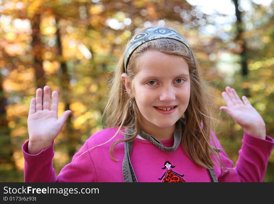 Happy girl in the autumn forest with colourful leaves. Happy girl in the autumn forest with colourful leaves