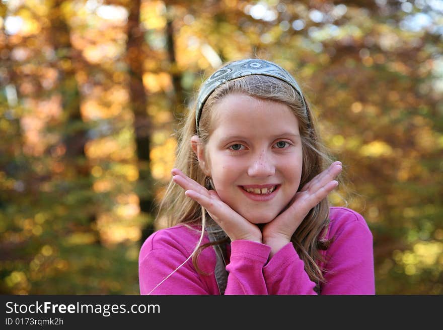 Happy girl in the autumn forest with colourful leaves. Happy girl in the autumn forest with colourful leaves