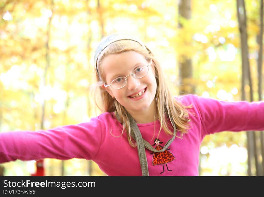 Happy girl in the autumn forest with colourful leaves. Happy girl in the autumn forest with colourful leaves