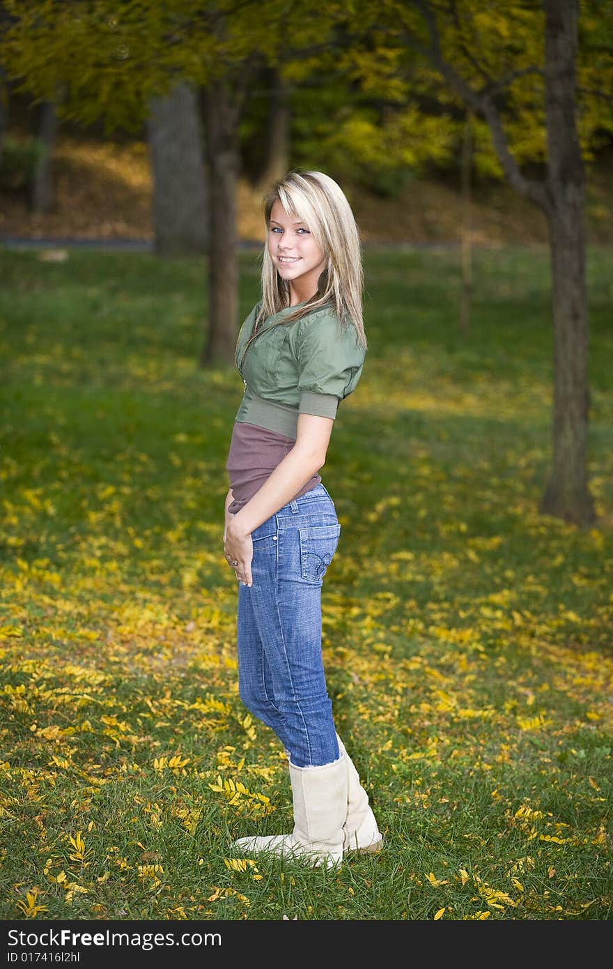 A beautiful blond teenage girl in the park. A beautiful blond teenage girl in the park