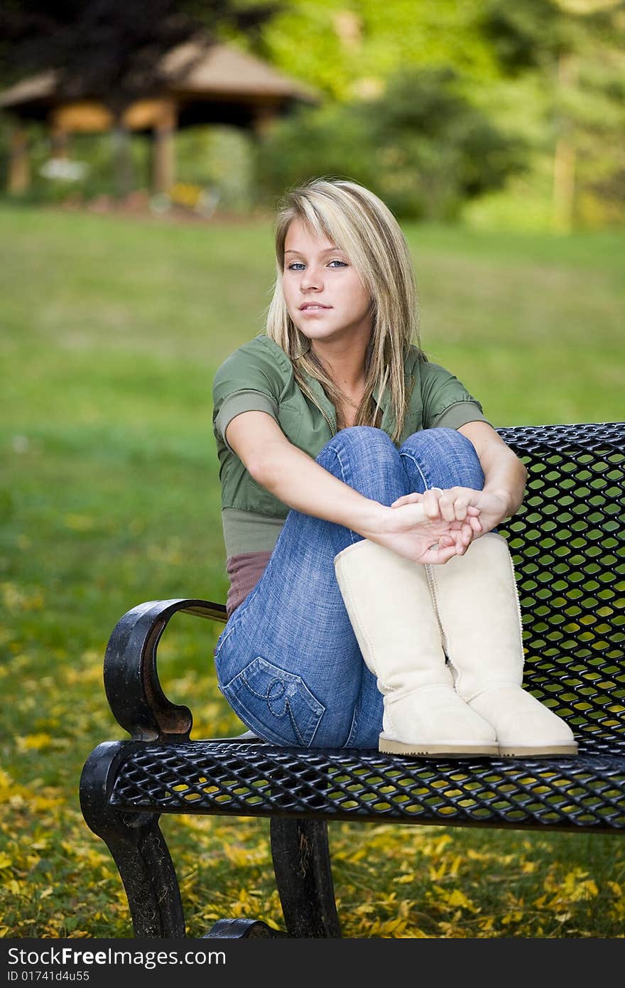 A beautiful blond teenage girl in the park. A beautiful blond teenage girl in the park