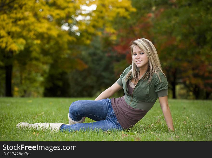 A beautiful blond teenage girl in the park. A beautiful blond teenage girl in the park