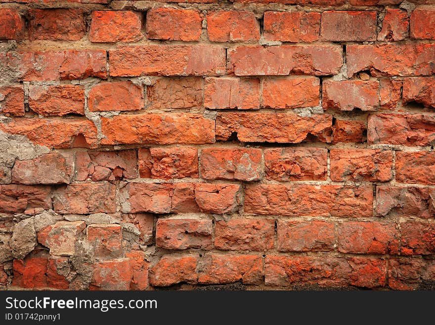 Damaged brick wall can serve as background. Damaged brick wall can serve as background