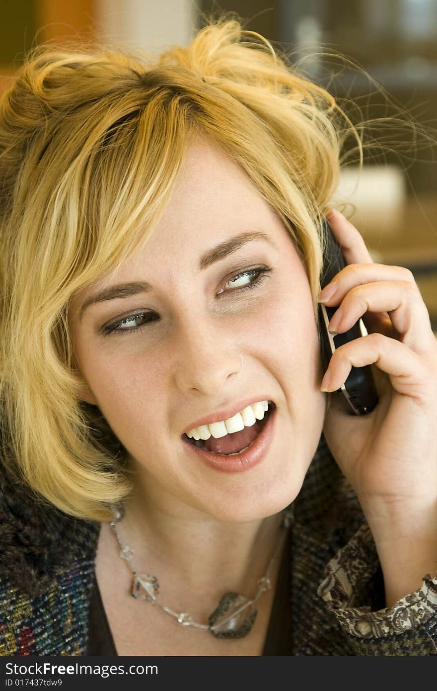 Young Blonde Caucasian Woman Talking on Mobile Phone. Young Blonde Caucasian Woman Talking on Mobile Phone