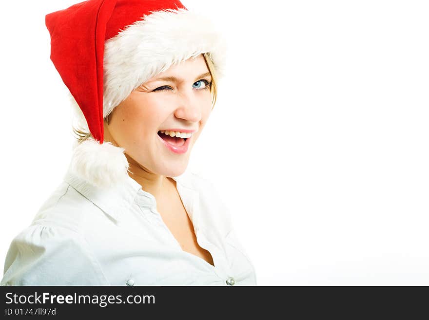 Girl in Santa hat looking at camera and wink. Girl in Santa hat looking at camera and wink.