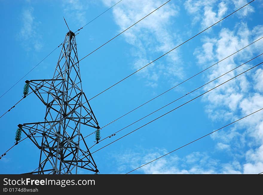 Electricity tower against the blue sky