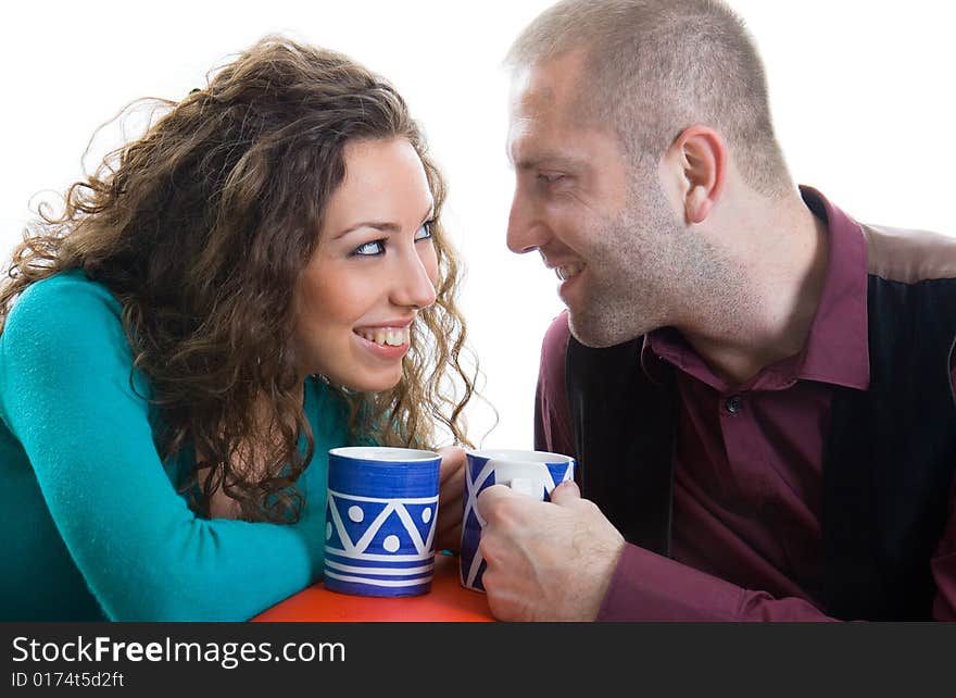 Young love couple smiling isolated on white back