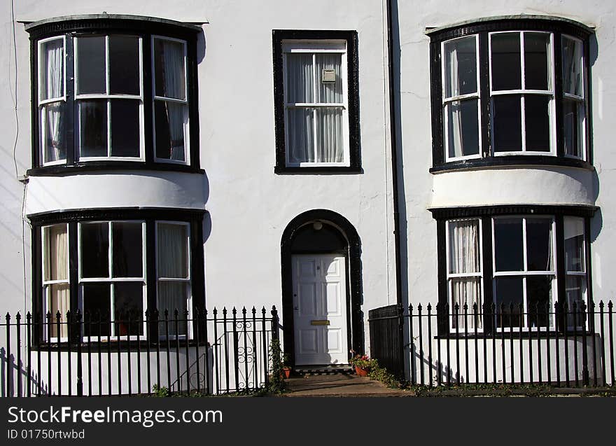 Black and white regency period terrace row housing at Seaton in Devon England. Black and white regency period terrace row housing at Seaton in Devon England