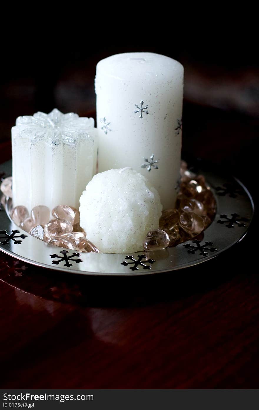 Pure white beautiful christmas candle on table. Pure white beautiful christmas candle on table