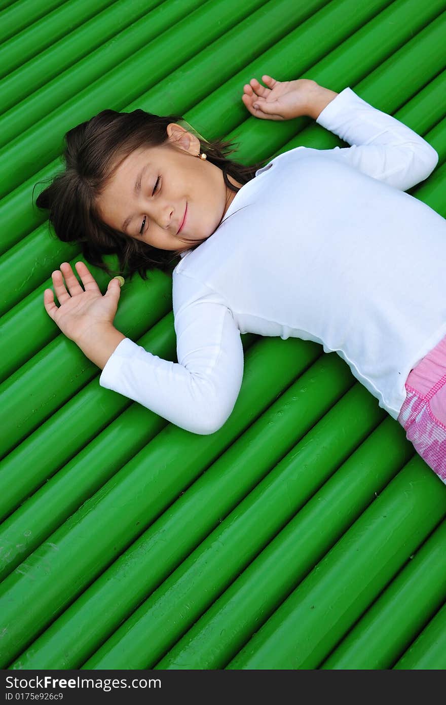 Little girl portrait on green background, close up. Little girl portrait on green background, close up