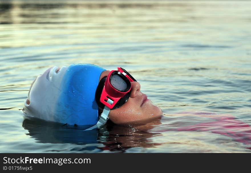 Little girl portrait swimming in sea, close up. Little girl portrait swimming in sea, close up