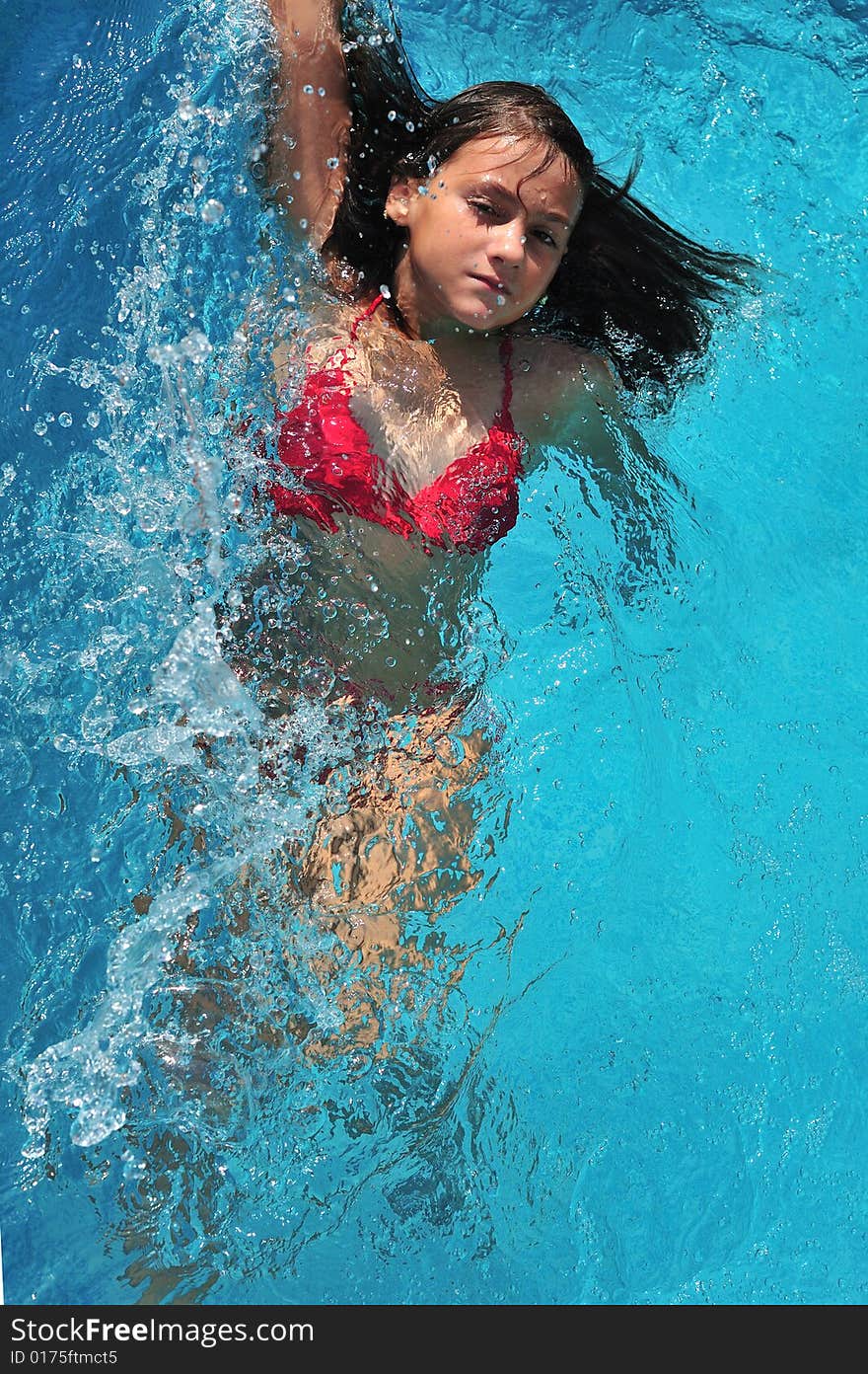 Top view of a girl swimming in pool. Top view of a girl swimming in pool