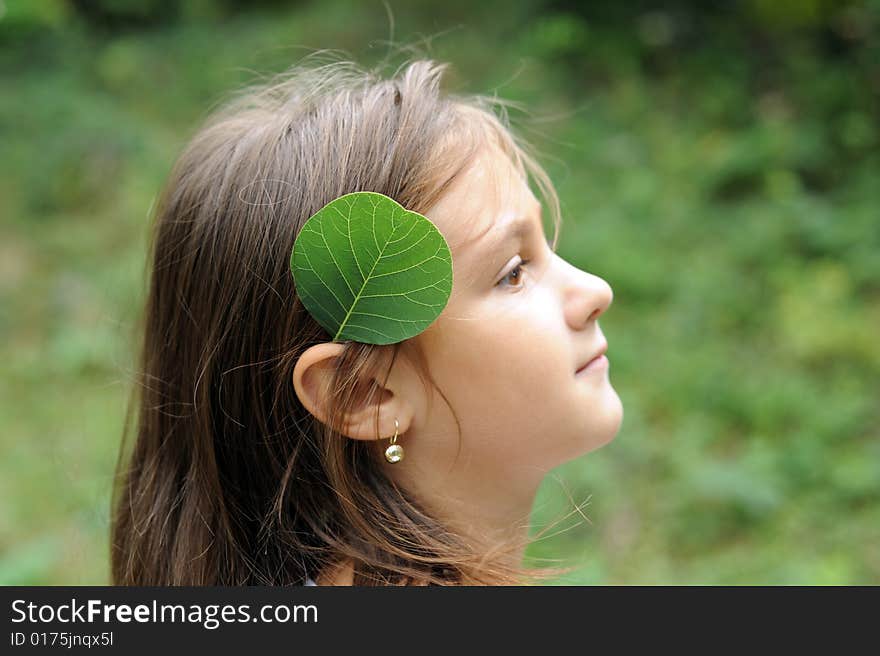 Girl and green leaf