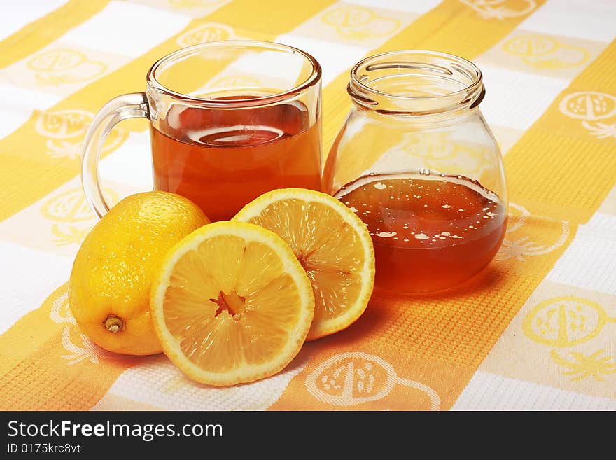 Tea With Honey and Lemon on a Table. Tea With Honey and Lemon on a Table