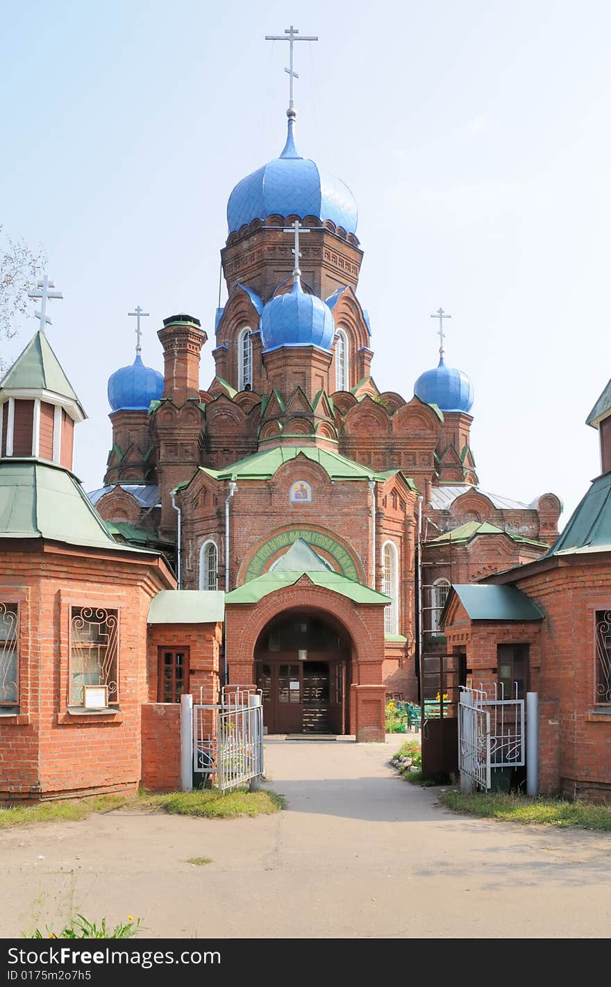 Orthodox church from a red brick with blue domes