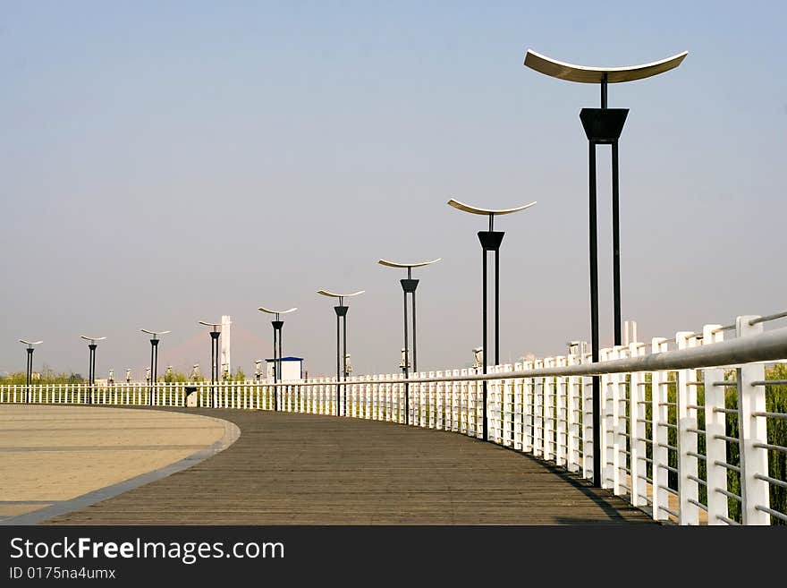 The street lamp with the blue sky background.