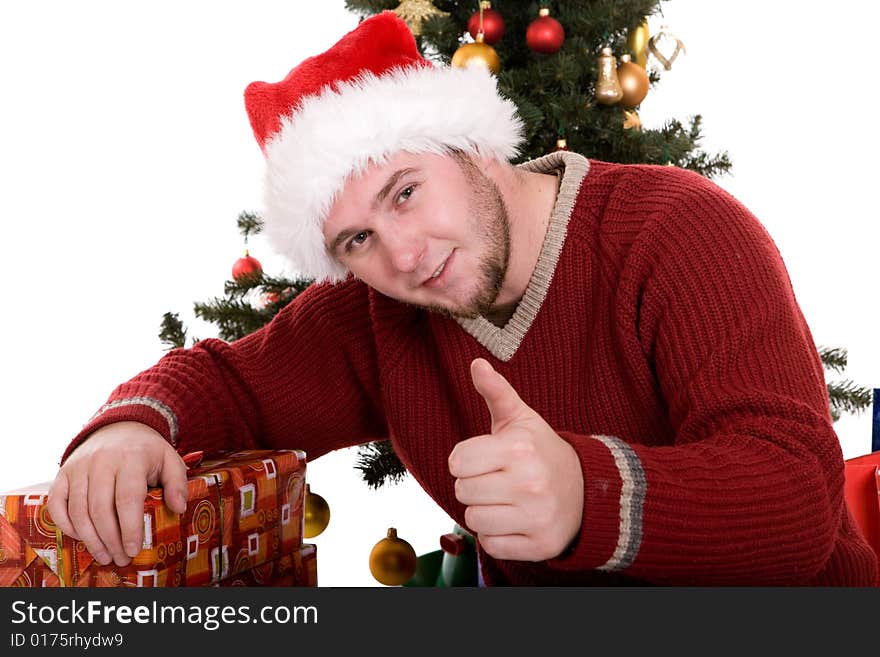 Happy man with gifts over christmas tree. Happy man with gifts over christmas tree