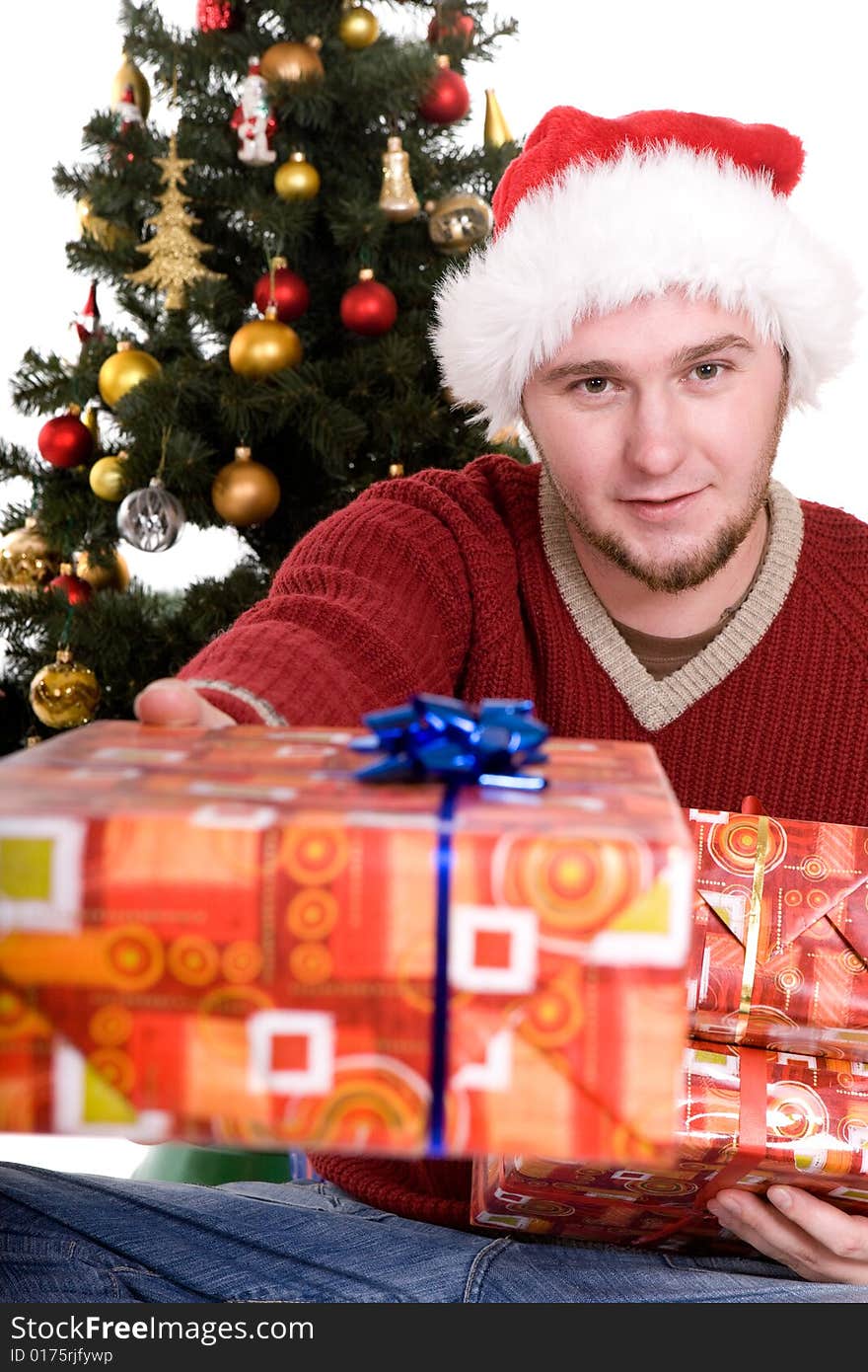 Happy man with gifts over christmas tree. Happy man with gifts over christmas tree