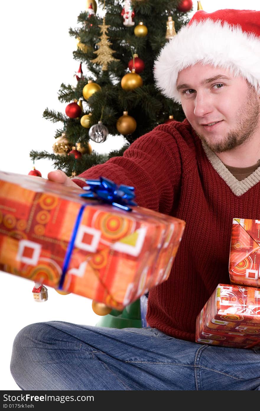 Happy man with gifts over christmas tree. Happy man with gifts over christmas tree