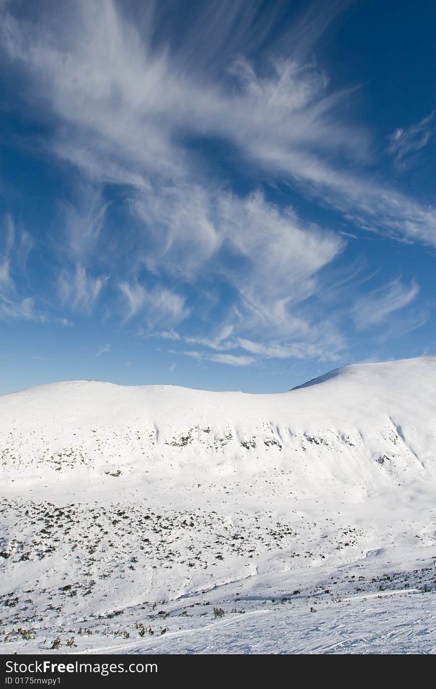 Impressive clouds above the high peaks of the mountains. Impressive clouds above the high peaks of the mountains